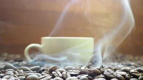 Move the camera slowly from left to right.hot roasted coffee beans with soft Stock Footage 182472901