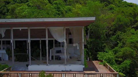 Move closer to abandoned building, curtain rag hand under roof, empty pavilion Stock Footage