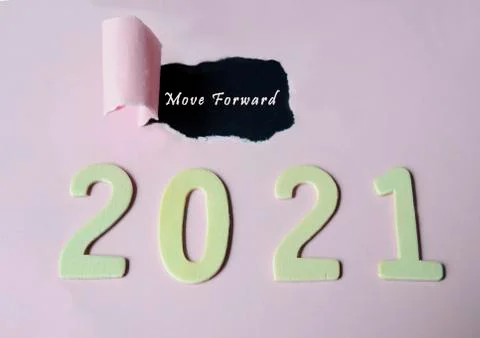 Move forward word on torn paper with Year 2021 background Stock Photos