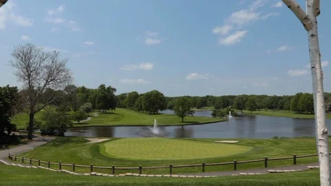 Move from golf course view out to reveal wedding canopy Stock Footage 108361096