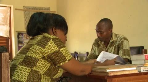 MOVE ON HEADMASTER AND TEACHER DISCUSSING PAPERS Stock Footage 60116183