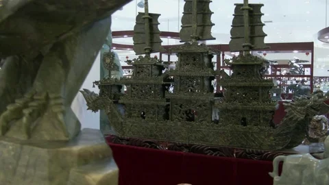 Move from large jade ship to close of a mythical bird of China, 4K. Stock Footage 79699428