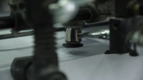 Move the paper sheets in the printing press suction cups. Close up. Stock-Footage 98120269