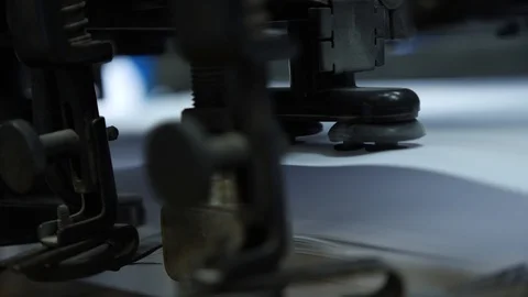 Move the paper sheets in the printing press suction cups. Stock Footage 98120665