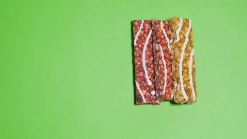 Move in place of different protein bars on a green background of chromakey Stock Footage 126143435