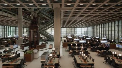 A move right to left across desks from above looking at the Lloyd's Lutine bell Stock Footage 296801210