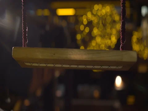 Move of swing on the golden lights background 4K Video stock 71533322