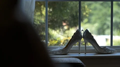 Move toward bride shoes in window engagement ring Stock Footage 114186063