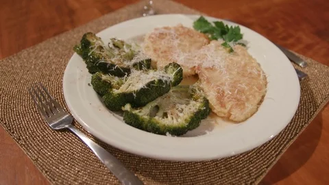Move Toward Over Chicken and Broccoli Dish Place Setting Stock Footage 81276823