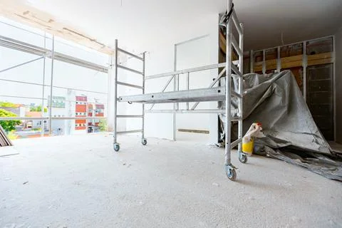 Moveable scaffold with wheels in the building under construction Stock Photos