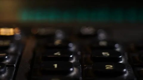 Movement along the buttons of an old black calculator close-up Stock Footage 252037741