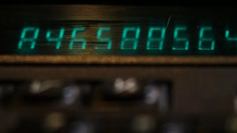 Movement along the digital panel of an old black calculator close-up Stock Footage 252037742