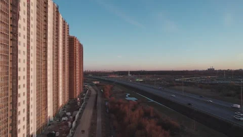 Movement along a house under construction at sunset unfinished house from a Stock Footage 243121543