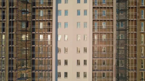 Movement along a house under construction at sunset unfinished house from a Stock Footage 243121797