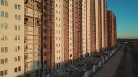 Movement along a house under construction at sunset unfinished house from a Stock Footage 243121879