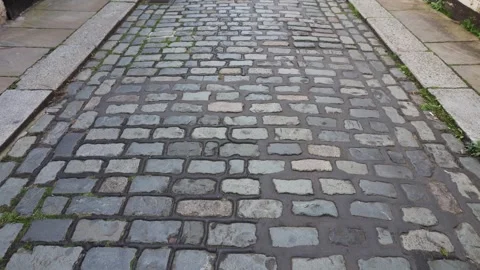 Movement Along the Old Stone Road in a Town Stock Footage 249184730