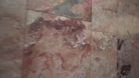 Movement along the red marble wall Vídeos de archivo 121853696