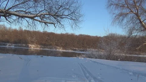 Movement along the winter river 스톡 동영상 100987201