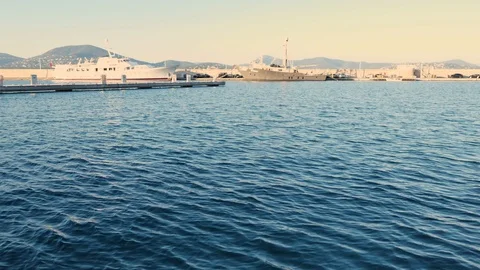 Movement and play of waves on the blue Mediterranean Sea in the port with yachts Stock Footage 123493628