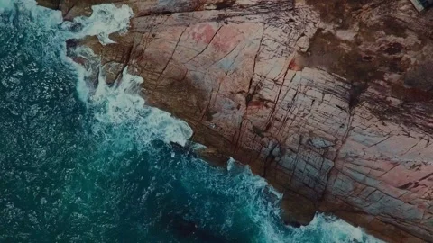 Movement and splash of waves against the rocks. Figure of man. View from the sky Stock Footage 172296715