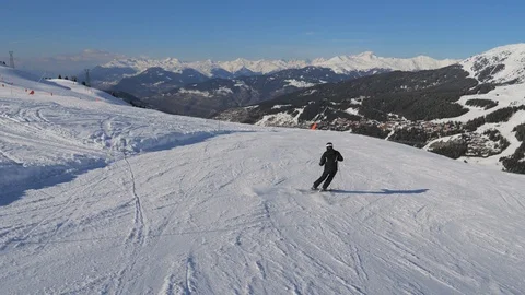 In Movement Back View Of The Skier Go Down The Ski Slope Carving Stock Footage 88626851