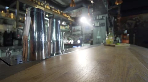 Movement on bar plot to an exotic cocktail and a bottle of bourbon Vídeos de archivo 62198255