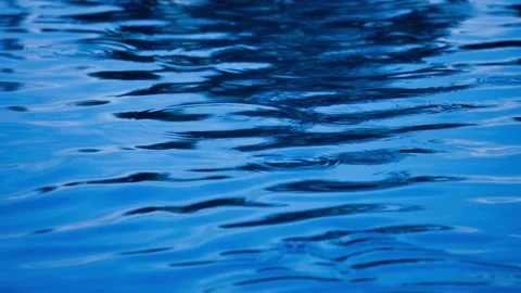 Movement of the blue water surface because of the wind when it is raining Vídeos de archivo 188823924