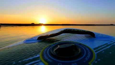 Movement on a board on the water surface to the sun Stock Footage 251962288