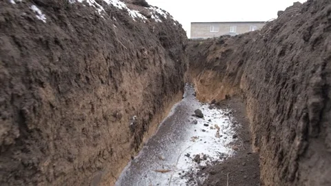 The movement of the bottom of the earth trenches dug for the military Stock Footage 233378258
