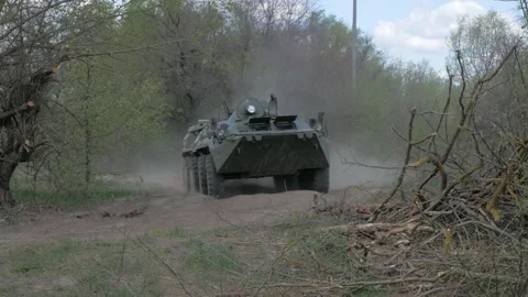 Movement of the BTR-80 outside the city Stock Footage 194099869