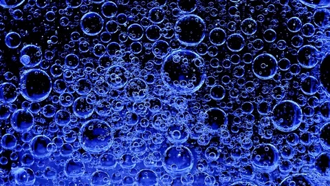 Movement of bubbles in liquid. Blue color. 库存影片 103286897