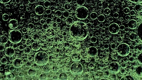 Movement of bubbles in liquid. Green color. Stock Footage 103273247