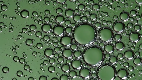 The movement of bubbles in the liquid green Stock Footage 84754091