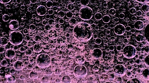Movement of bubbles in liquid. Pink color. Stock Footage 103273243