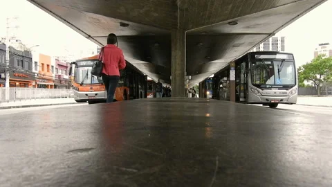 Movement of buses an passengers on Ana Rosa Bus Terminal Stock Footage 121732467
