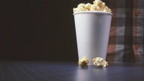 The movement of the camera on a glass of popcorn and a pouring cola slow motion Stock Footage 87879867