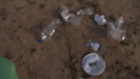The movement of the camera at the hand, which collects plastic trash Stock-Footage 117808954
