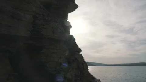 The movement of the camera from the rock to the ray of the sun Video stock 257539237