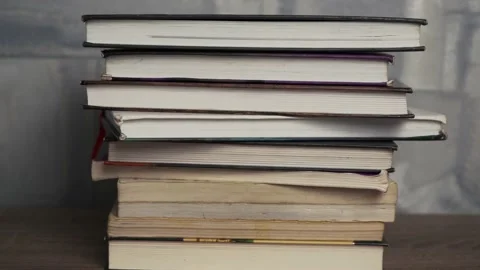 Movement of the camera towards the pile of old books. Stock Footage 153932888