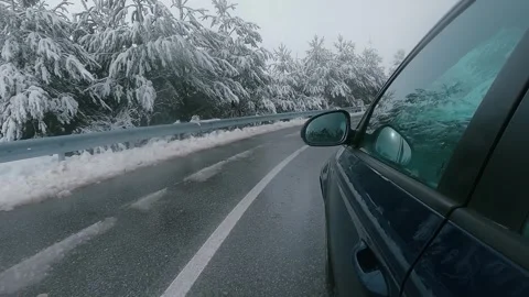 Movement of the car in the winter. A driving in mountain asphalt road Stock Footage 325616143