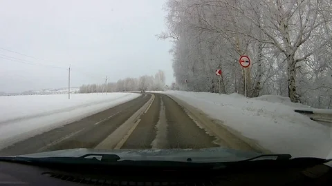 The movement of the car on the winter snow-covered road. Stock Footage 121879271