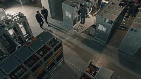 Movement of chief engineers with digital tablet through assembly hall of plant Video stock 265622756