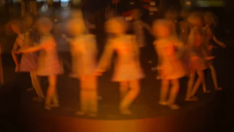 The movement in a circle of many dolls forming a dance movement. Stock Footage 121761371