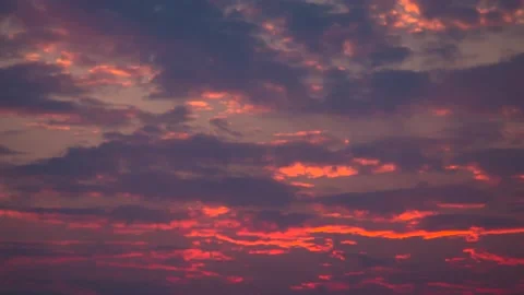 The movement of clouds across the red sky Stock Footage 151423924
