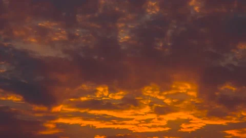 The movement of clouds across the red sky Stock Footage 151423940