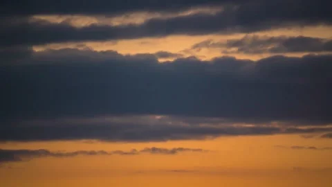 The movement of clouds across the red sky Stock Footage 151424961