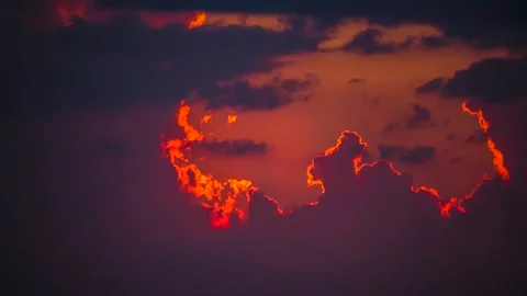 The movement of clouds across the red sky Stock Footage 151425428