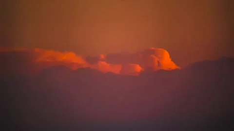 The movement of clouds across the red sky Stock Footage 151426367