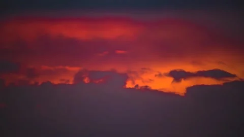 The movement of clouds across the red sky Stock Footage 151426679
