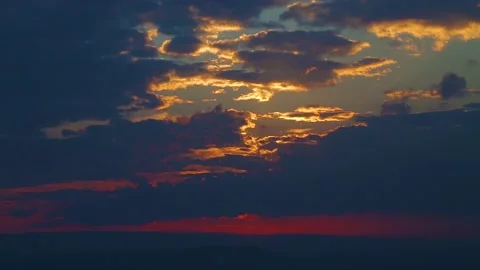 The movement of clouds across the red sky Stock Footage 151427245
